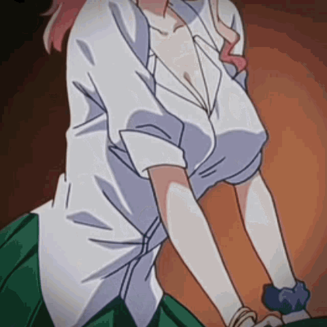 a close up of a woman 's breasts in a white shirt