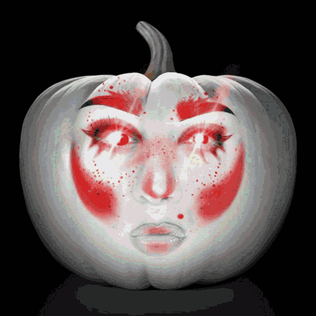 a pumpkin with a face painted on it