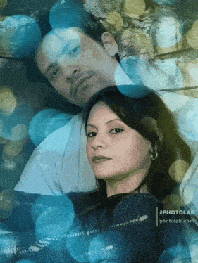 a painting of a man and a woman with #photolab.com in the corner