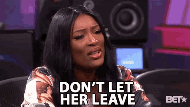 a woman says " don 't let her leave " in front of a speaker