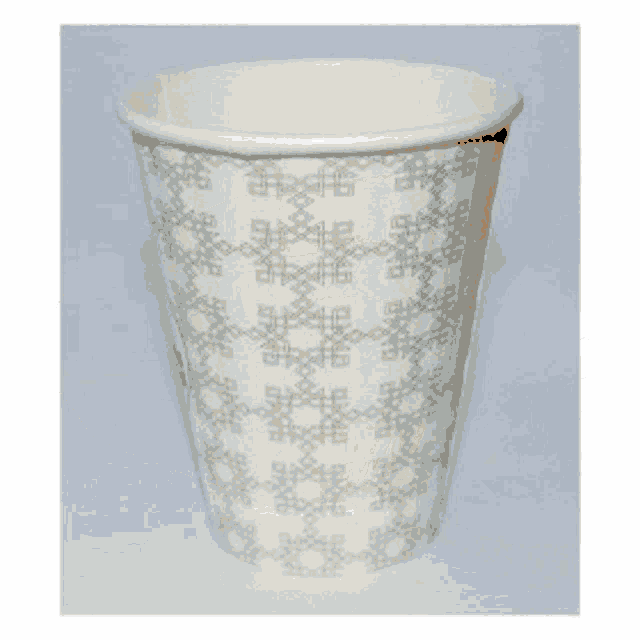 a white paper cup with a gray pattern on it