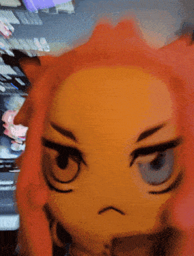 a close up of a stuffed animal with a serious look on its face