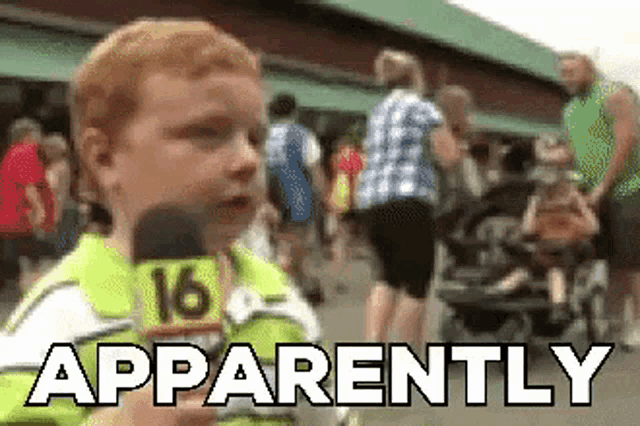 a little boy is holding a microphone and says apparently