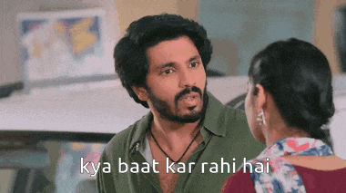 a man with a beard is talking to a woman with the words kya baat kar rahi hai