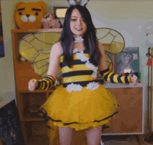 a woman dressed in a bee costume with wings