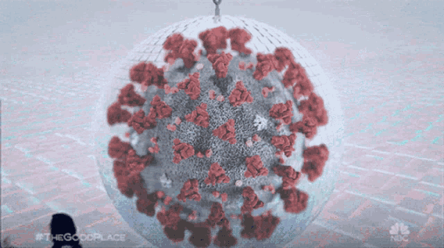 an animated image of a disco ball with the words " the good place " on the bottom right