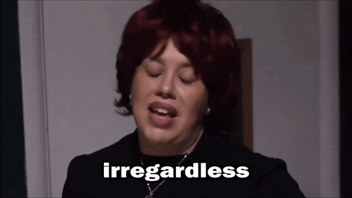 a woman with red hair says ' iregarless ' in front of her face