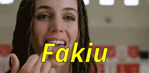 a woman with dreadlocks is giving the middle finger and the word fakiu is on the screen behind her