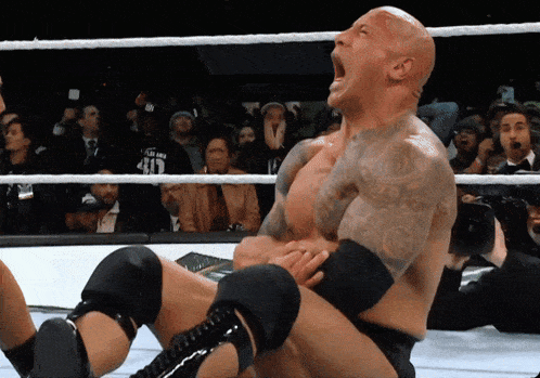 a man in a wrestling ring with a shirt that says 41 on it