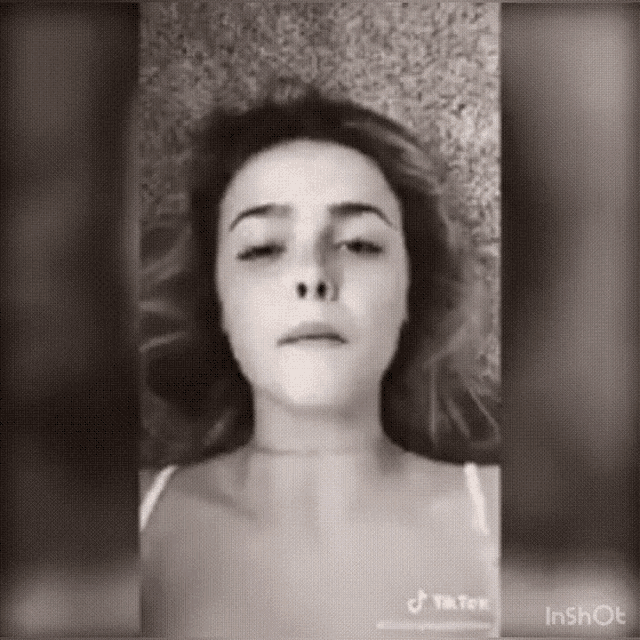a woman 's face is shown in a black and white photo with the hashtag tik tok