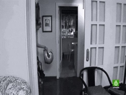 a black and white photo of a room with the number 6 on the bottom