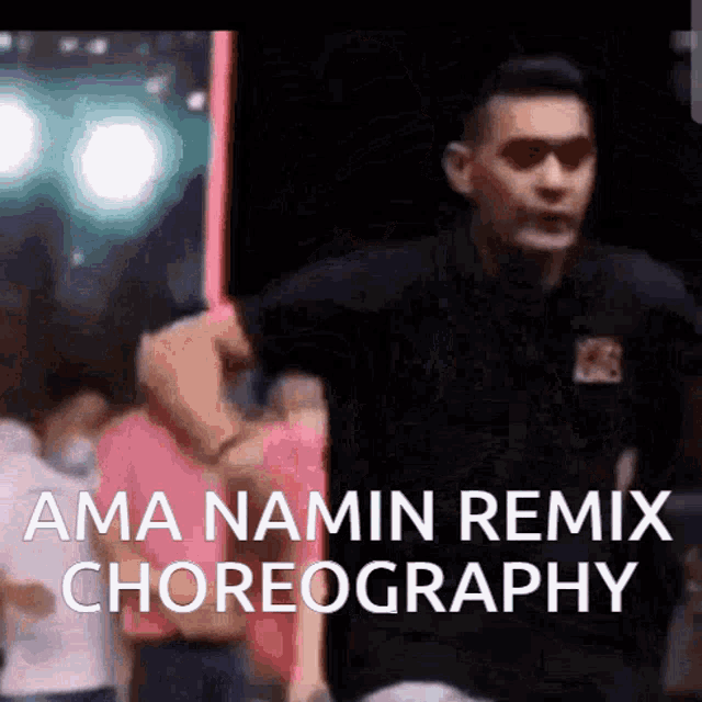 a man in a black shirt is dancing with the words ama namin remix choreography in the background
