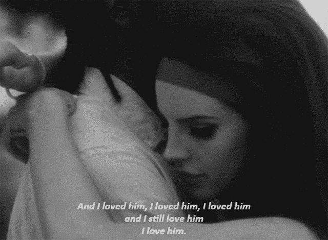 a black and white photo of a woman hugging a man with the words and i loved him i loved him