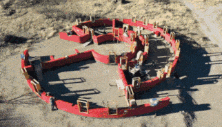 an aerial view of a large red circle in the middle of a desert