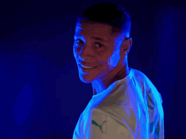 a man wearing a white shirt with the name harit on the back