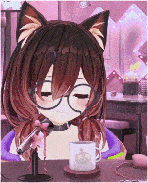 a girl with cat ears is sitting in front of a microphone next to a cup that says peace on it