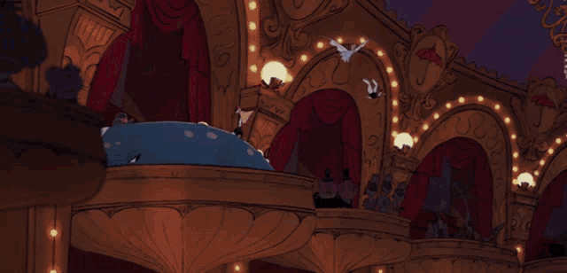 a group of cartoon characters are sitting in a theater with umbrellas