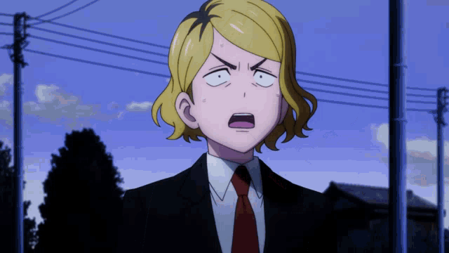 a man in a suit and tie is making a surprised face