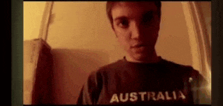 a young man is wearing a australia shirt