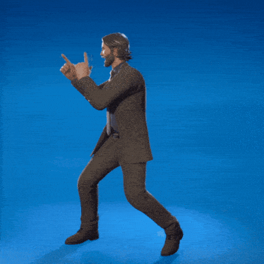 a man in a suit is dancing and pointing