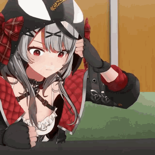 a girl in a red and black outfit has a helmet that says cau on it
