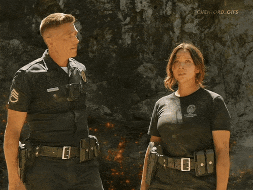 a police officer is hugging a woman with the word gifs visible in the corner