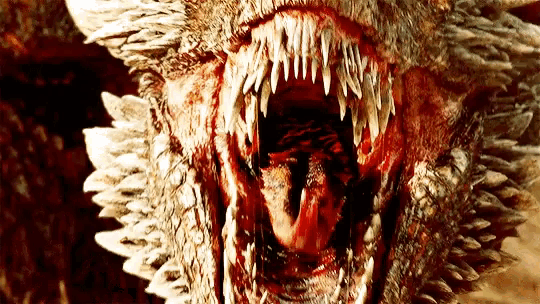 a close up of a dragon 's mouth with its mouth open