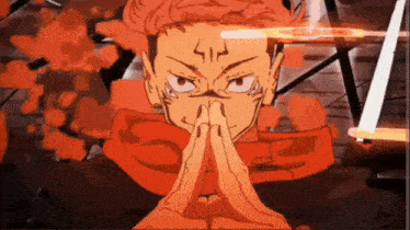 a close up of a person 's face with their hands folded in front of their face .