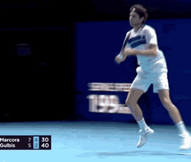 a man playing tennis with a score of 199