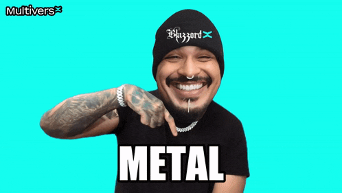a man wearing a black beanie and a black shirt with the word metal on it