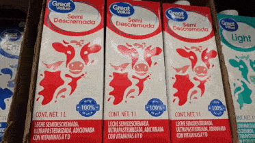 several cartons of great value semidescremada are lined up in a row
