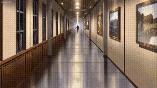 a long hallway with paintings on the walls