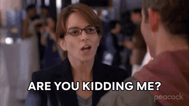 a woman with glasses is talking to a man and says are you kidding me ?