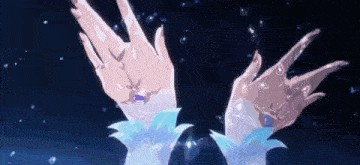 a close up of a person 's hands with bubbles coming out of them in the water .