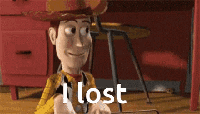 woody from toy story is sitting in front of a red desk and holding a piece of paper .