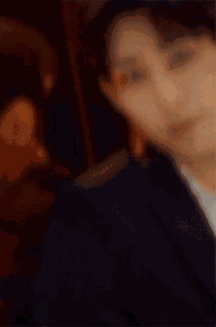 a close up of a man in a suit and tie