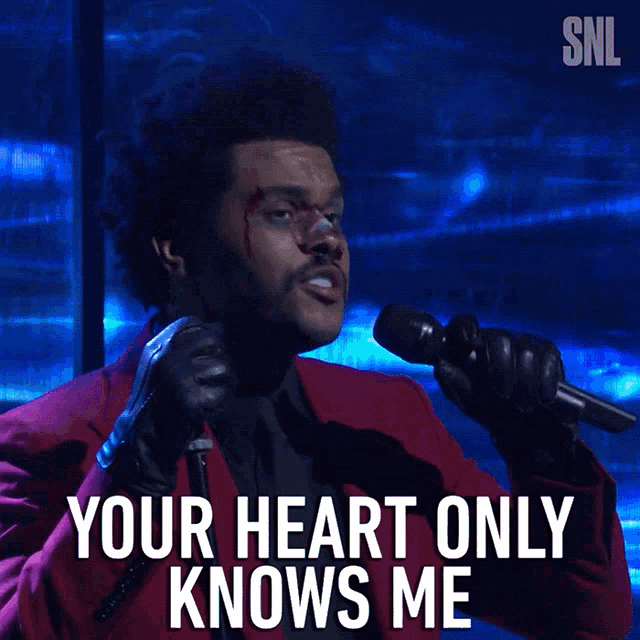 a man singing into a microphone with the words " your heart only knows me "