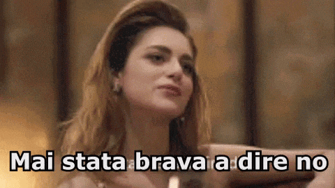 a close up of a woman 's face with the words mai stata brava a dire no