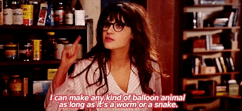 a woman wearing glasses is making a funny face while talking about balloons .