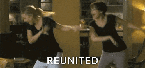 two women are dancing in a living room and the word reunited is on the bottom right