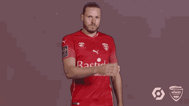 a man wearing a red jersey that says stick medica