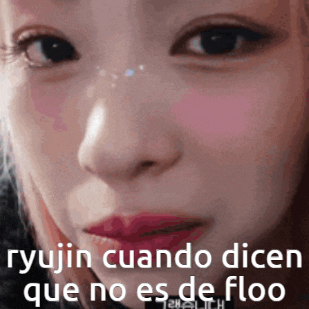 a close up of a woman 's face with the words " ryujin cuando dicen que no es de floo " on the bottom