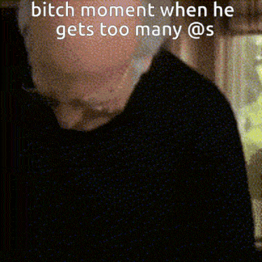 a man in a black shirt with a caption that says bitch moment when he gets too many @ s