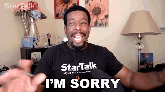 a man wearing a startalk t-shirt says i 'm sorry