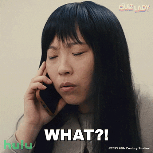 a woman is talking on a cell phone with the words what written below her
