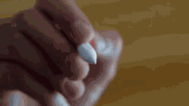 a close up of a pen writing the letter j