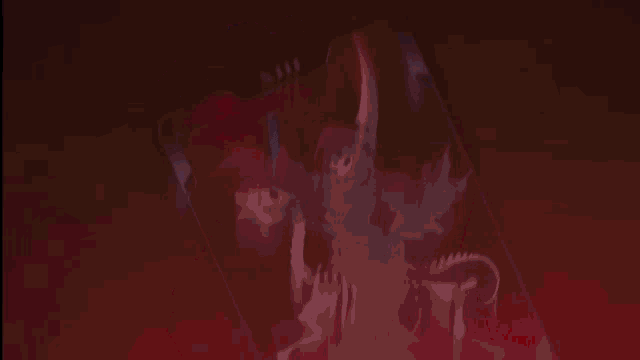 a close up of a person 's fist in a red background