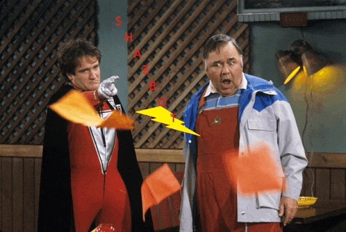 two men are standing next to each other and one of them is wearing a jacket with a john deere logo on it