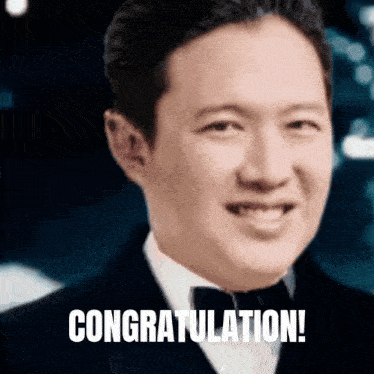 a man in a tuxedo is smiling and the words congratulations are written below him