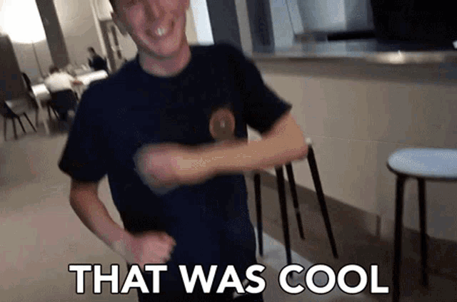 a man is dancing in a room with the words that was cool above him
